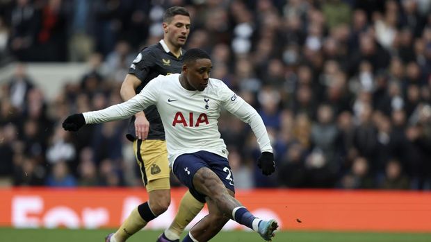 Newcastle's Fabian Schaer, left, scores the opening goal of his team during the Premier League soccer match between Tottenham Hotspur and Newcastle at Tottenham Hotspur stadium, in London, England, Sunday, April 3, 2022. (AP Photo/Ian Walton)