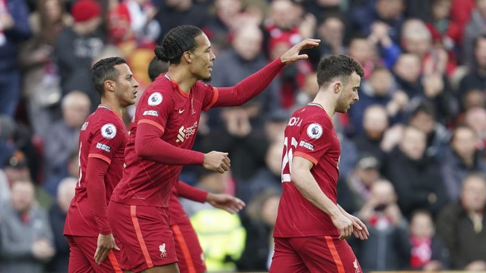 Liverpools Diogo Jota, right, celebrates with his teammates after scoring his sides opening goal during the English Premier League soccer match between Liverpool and Watford at Anfield stadium in Liverpool, England, Saturday, April 2, 2022. (AP Photo/Jon Super)