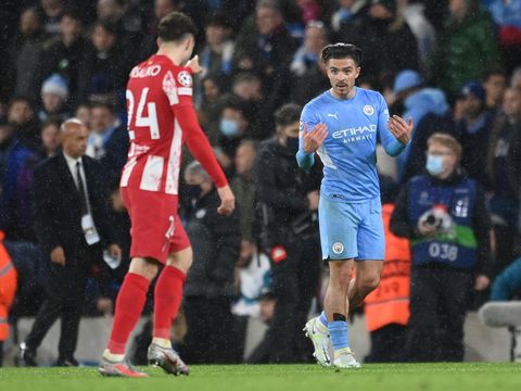 MANCHESTER, ENGLAND - APRIL 05: Jack Grealish of Manchester City taunts Sime Vrsaljko of Atletico Madrid during the UEFA Champions League Quarter Final Leg One match between Manchester City and Atletico Madrid at City of Manchester Stadium on April 05, 2022 in Manchester, England. (Photo by Michael Regan/Getty Images)