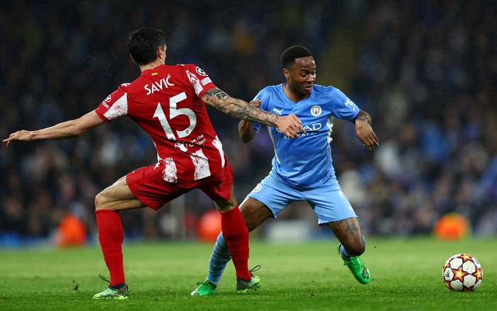 MANCHESTER, ENGLAND - APRIL 05: Raheem Sterling of Manchester City is challenged by Stefan Savic of Atletico Madrid during the UEFA Champions League Quarter Final Leg One match between Manchester City and Atletico Madrid at City of Manchester Stadium on April 05, 2022 in Manchester, England. (Photo by Clive Brunskill/Getty Images)