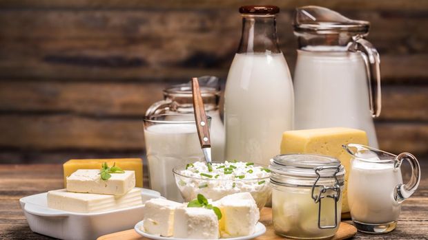 Still life with dairy product on wooden background
