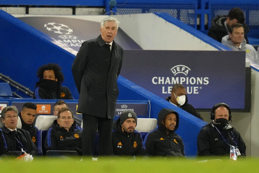 Real Madrid's head coach Carlo Ancelotti grimaces during a Champions League first-leg quarterfinal soccer match between Chelsea and Real Madrid at Stamford Bridge stadium in London, Wednesday, April 6, 2022. (AP Photo/Kirsty Wigglesworth)