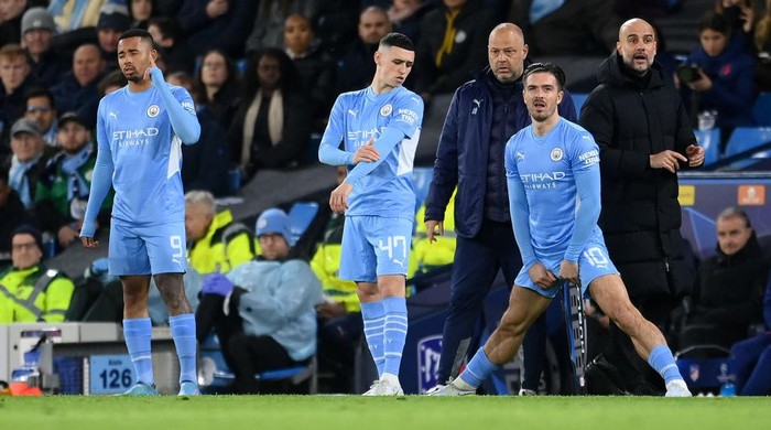 MANCHESTER, ENGLAND - APRIL 05: Gabriel Jesus, Phil Foden and Jack Grealish of Manchester City prepare to come on during the UEFA Champions League Quarter Final Leg One match between Manchester City and Atletico Madrid at City of Manchester Stadium on April 05, 2022 in Manchester, England. (Photo by Michael Regan/Getty Images)