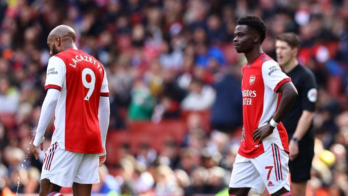 Soccer Football - Premier League - Arsenal v Brighton & Hove Albion - Emirates Stadium, London, Britain - April 9, 2022 Arsenals Bukayo Saka looks dejected REUTERS/David Klein EDITORIAL USE ONLY. No use with unauthorized audio, video, data, fixture lists, club/league logos or live services. Online in-match use limited to 75 images, no video emulation. No use in betting, games or single club /league/player publications.  Please contact your account representative for further details.