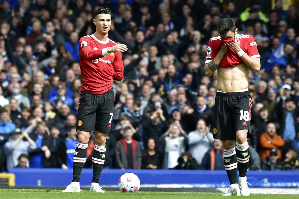 Manchester United's Marcus Rashford, left, loses the ball to Everton's Seamus Coleman during the Premier League soccer match between Everton and Manchester United at Goodison Park, in Liverpool, England, Saturday, April 9, 2022. (AP Photo/Rui Vieira)