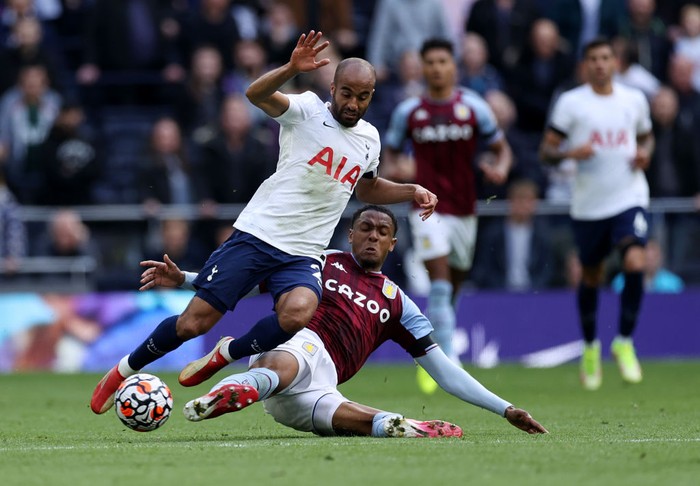 LONDON, ENGLAND - OCTOBER 03: Lucas Moura of Tottenham Hotspur is tackled by Ezri Konsa of Aston Villa during the Premier League match between Tottenham Hotspur and Aston Villa at Tottenham Hotspur Stadium on October 03, 2021 in London, England. (Photo by Eddie Keogh/Getty Images)