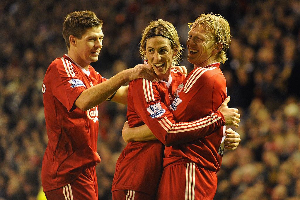 LIVERPOOL, ENGLAND - DECEMBER 13:  Dirk Kuyt (R) of Liverpool celebrates scoring the opening goal with team mates Steven Gerrard (L) and Fernando Torres during the Barclays Premier League match between Liverpool and Arsenal at Anfield on December 13, 2009 in Liverpool, England.  (Photo by Michael Regan/Getty Images)