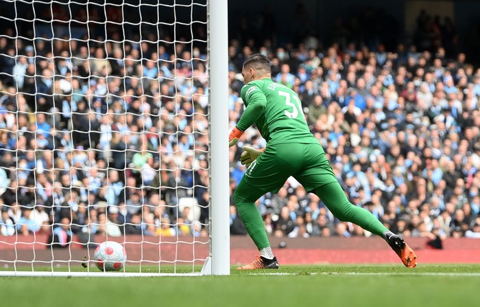 MANCHESTER, ENGLAND - APRIL 10: Ederson of Manchester City chases after the ball after almost allowing it to enter his own net during the Premier League match between Manchester City and Liverpool at Etihad Stadium on April 10, 2022 in Manchester, England. (Photo by Michael Regan/Getty Images)