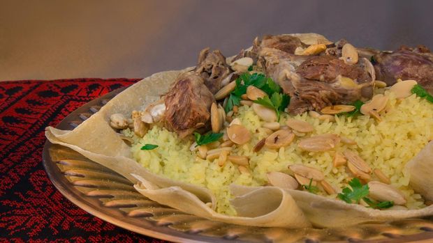 traditional Jordanian and Palestinian dish.made of lamb cooked in a sauce of fermented dried yogurt and served with rice