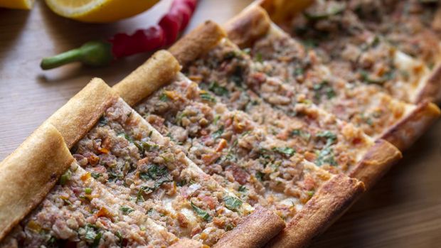 Turkish pide with minced meat, Turkish name; Kiymali Pide. Traditional Turkish cuisine. Turkish pizza Pita with meat.