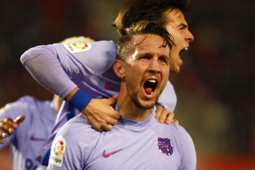 Barcelona's Luuk de Jong celebrates scoring his side's 3rd goal against Athletic Bilbao during a Spanish La Liga soccer match at the Camp Nou stadium in Barcelona, Spain, Sunday, Feb. 27, 2022. (AP Photo/Joan Monfort)