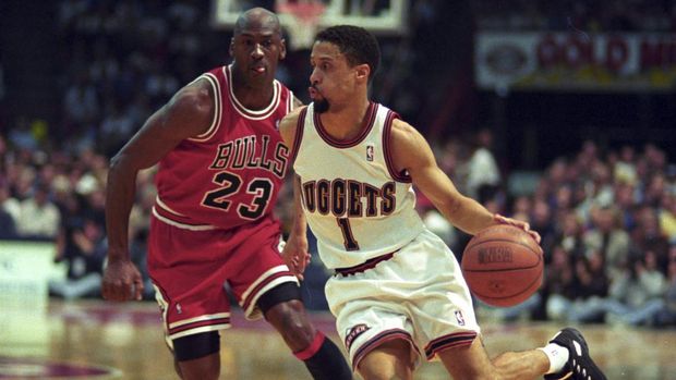Denver Nuggets guard Mahmoud Abdul-Rauf, right, works the ball past Chicago Bulls' guard Michael Jordan during the first quarter in Denver's McNichols Sports Arena, Feb. 4, 1996.  (AP Photo/David Zalubowski)