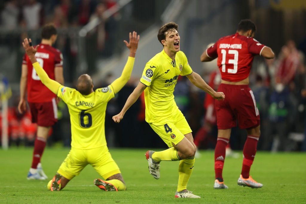 MUNICH, GERMANY - APRIL 12: Pau Torres and Etienne Capoue of Villarreal CF celebrate following their draw and advancement in the UEFA Champions League Quarter Final Leg Two match between Bayern München and Villarreal CF at Football Arena Munich on April 12, 2022 in Munich, Germany. (Photo by Alexander Hassenstein/Getty Images)