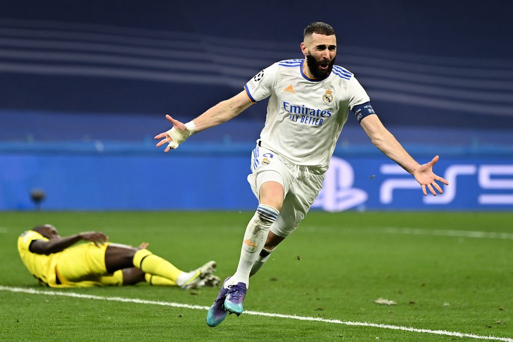 MADRID, SPAIN - APRIL 12: Karim Benzema of Real Madrid celebrates after scoring their team's second goal during the UEFA Champions League Quarter Final Leg Two match between Real Madrid and Chelsea FC at Estadio Santiago Bernabeu on April 12, 2022 in Madrid, Spain.  (Photo by David Ramos/Getty Images)