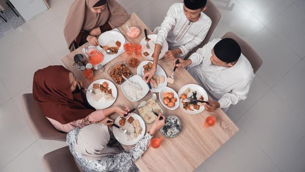 top view muslim family enjoy the iftar meal dinner together in dining room