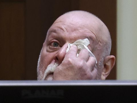 Isaac Baruch wipes tears as he testifies during Johnny Depp's defamation trial against his ex-wife Amber Heard at the Fairfax County Circuit Courthouse in Fairfax, Virginia, on April 13, 2022. - Heard is being sued for defamation by her former husband, US actor Johnny Depp, after she wrote an op-ed in The Washington Post in 2018 that, without naming Depp, accused him of domestic abuse. (Photo by EVELYN HOCKSTEIN / POOL / AFP)