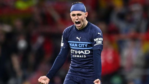 MADRID, SPAIN - APRIL 13: Phil Foden of Manchester City celebrates after the UEFA Champions League Quarter Final Leg Two match between Atletico Madrid and Manchester City at Wanda Metropolitano on April 13, 2022 in Madrid, Spain. (Photo by Shaun Botterill/Getty Images)