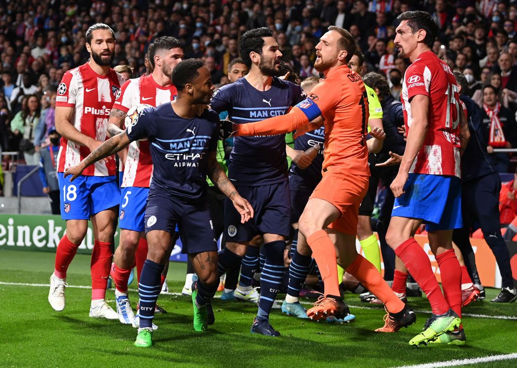 MADRID, SPAIN - APRIL 13: İlkay Gundogan and Raheem Sterling of Manchester City clash with Jan Oblak and Stefan Savic of Atletico Madrid during the UEFA Champions League Quarter Final Leg Two match between Atletico Madrid and Manchester City at Wanda Metropolitano on April 13, 2022 in Madrid, Spain. (Photo by Shaun Botterill/Getty Images)