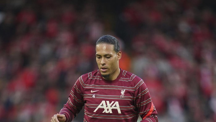 Liverpools Virgil van Dijk warms-up before the Champions League quarterfinal second leg soccer match between Liverpool and Benfica, at Anfield stadium in Liverpool, England, Wednesday, April 13, 2022. (AP Photo/Jon Super)