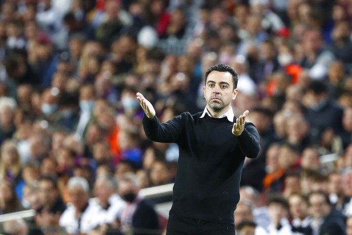 Barcelonas head coach Xavi Hernandez gestures during the Europa League, second leg, quarterfinal soccer match between Barcelona and Eintracht Frankfurt at the Camp Nou stadium, in Barcelona, Spain, Thursday, April 14, 2022. (AP Photo/Joan Monfort)