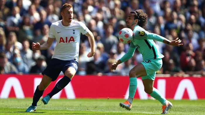 LONDON, ENGLAND - APRIL 16: Marc Cucurella of Brighton & Hove Albion controls the ball whilst under pressure from Dejan Kulusevski of Tottenham Hotspur during the Premier League match between Tottenham Hotspur and Brighton & Hove Albion at Tottenham Hotspur Stadium on April 16, 2022 in London, England. (Photo by Clive Rose/Getty Images)