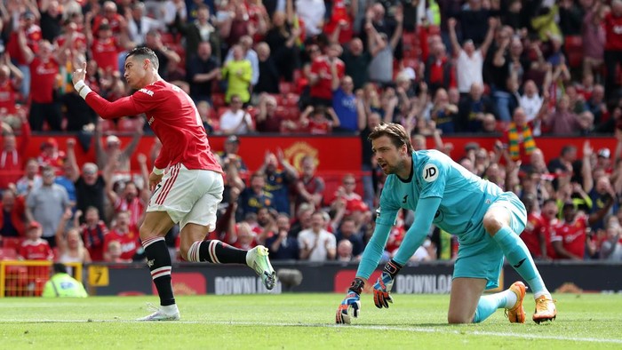 MANCHESTER, ENGLAND - APRIL 16: Cristiano Ronaldo of Manchester United celebrates after scoring their sides first goal past Tim Krul of Norwich City during the Premier League match between Manchester United and Norwich City at Old Trafford on April 16, 2022 in Manchester, England. (Photo by Jan Kruger/Getty Images)