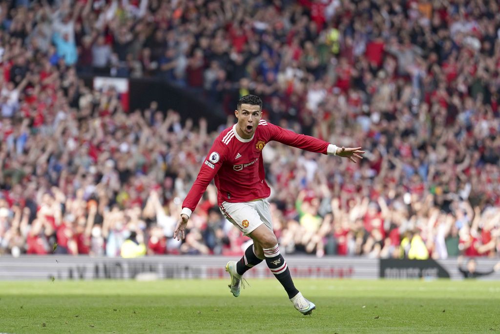 Manchester United's Cristiano Ronaldo celebrates after scoring his third goal during the English Premier League soccer match between Manchester United and Norwich City at Old Trafford stadium in Manchester, England, Saturday, April 16, 2022. (AP Photo/Jon Super)
