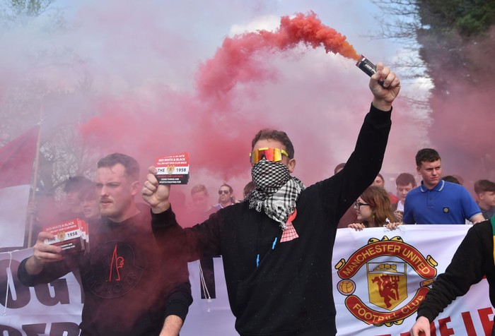 MANCHESTER, ENGLAND - APRIL 16:  Manchester United fans take part in a protest outside the stadium prior to the Premier League match between Manchester United and Norwich City at Old Trafford on April 16, 2022 in Manchester, England. (Photo by Nathan Stirk/Getty Images)