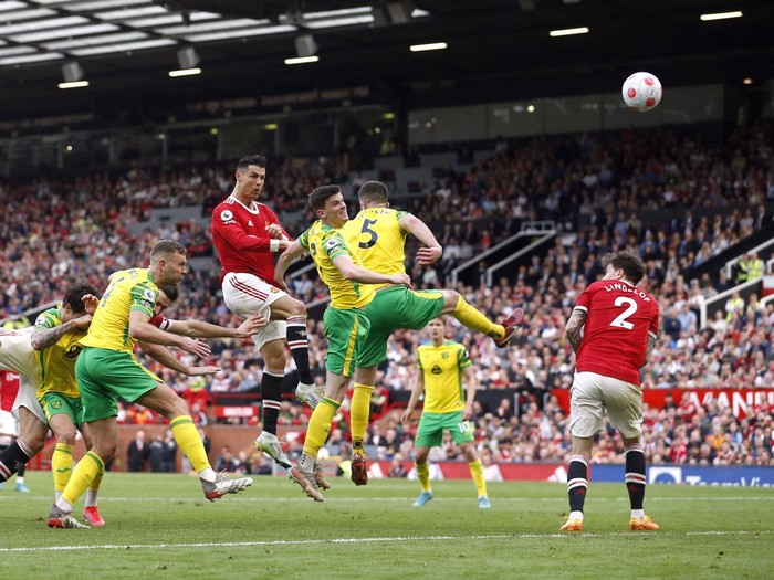 Soccer Football - Premier League - Manchester United v Norwich City - Old Trafford, Manchester, Britain - April 16, 2022 Manchester United's Cristiano Ronaldo with the match ball after scoring a hat-trick REUTERS/Craig Brough EDITORIAL USE ONLY. No use with unauthorized audio, video, data, fixture lists, club/league logos or 'live' services. Online in-match use limited to 75 images, no video emulation. No use in betting, games or single club /league/player publications.  Please contact your account representative for further details.