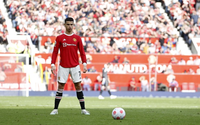SOCCER-ENGLAND-MUN-NOR/REPORT Soccer Football - Premier League - Manchester United v Norwich City - Old Trafford, Manchester, Britain - April 16, 2022 Manchester United's Cristiano Ronaldo with the match ball after scoring a hat-trick REUTERS/Craig Brough EDITORIAL USE ONLY. No use with unauthorized audio, video, data, fixture lists, club/league logos or 'live' services. Online in-match use limited to 75 images, no video emulation. No use in betting, games or single club /league/player publications. Please contact your account representative for further details.