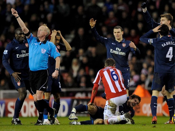 STOKE ON TRENT, ENGLAND - FEBRUARY 27:  Aaron Ramsey of Arsenal lies seriously injured following a challenge by Ryan Shawcross of Stoke City during the Barclays Premier League match between Stoke City and Arsenal at The Britannia Stadium on February 27, 2010 in Stoke on Trent, England.  (Photo by Laurence Griffiths/Getty Images)