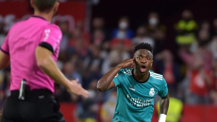 Real Madrids Brazilian forward Vinicius Junior reacts after his goal was cancelled during the Spanish League football match between Sevilla FC and Real Madrid CF at the Ramon Sanchez Pizjuan stadium in Seville on April 17, 2022. (Photo by CRISTINA QUICLER / AFP)