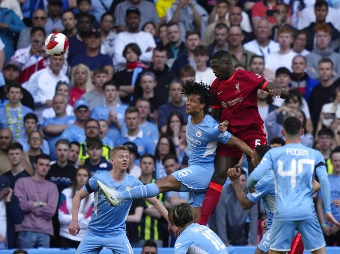 Liverpool's Ibrahima Konate applauds fans at the end of the English FA Cup semifinal soccer match between Manchester City and Liverpool at Wembley stadium in London, Saturday, April 16, 2022. (AP Photo/Frank Augstein)