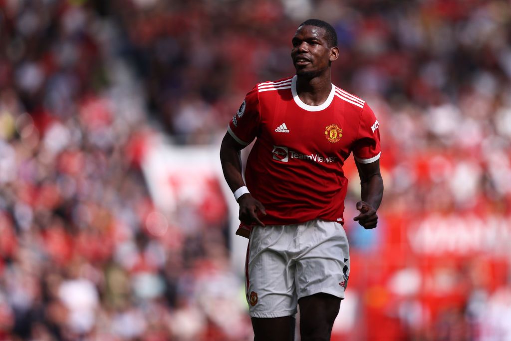 MANCHESTER, ENGLAND - APRIL 16: Paul Pogba of Manchester United in action during the Premier League match between Manchester United and Norwich City at Old Trafford on April 16, 2022 in Manchester, England. (Photo by Naomi Baker/Getty Images)
