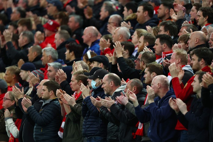 LIVERPOOL, ENGLAND - APRIL 19: Liverpool fans applaud during the Premier League match between Liverpool and Manchester United at Anfield on April 19, 2022 in Liverpool, England. (Photo by Clive Brunskill/Getty Images)
