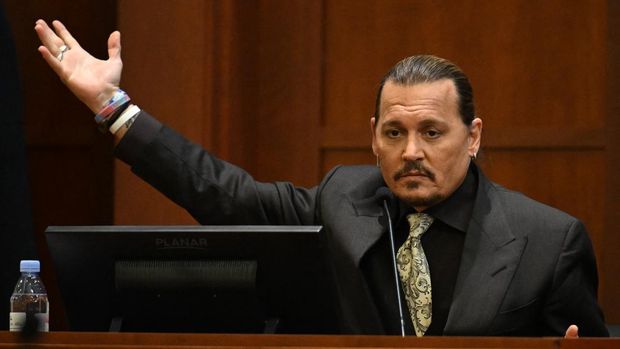 Johnny Depp US actor Johnny Depp looks on during his defamation trial in the Fairfax County Circuit Courthouse in Fairfax, Virginia, on April 19, 2022. - Depp is suing ex-wife Amber Heard for libel after she wrote an op-ed piece in The Washington Post in 2018 referring to herself as a public figure representing domestic abuse. (Photo by JIM WATSON / POOL / AFP)