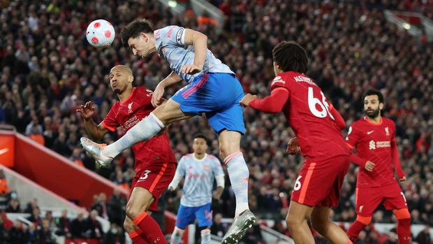 Soccer Football - Premier League - Liverpool v Manchester United - Anfield, Liverpool, Britain - April 19, 2022 Liverpool's Fabinho in action with Manchester United's Harry Maguire REUTERS/Phil Noble EDITORIAL USE ONLY. No use with unauthorized audio, video, data, fixture lists, club/league logos or 'live' services. Online in-match use limited to 75 images, no video emulation. No use in betting, games or single club /league/player publications.  Please contact your account representative for further details.