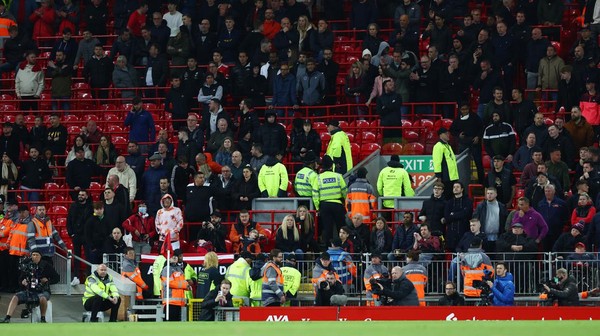 LIVERPOOL, ENGLAND - APRIL 19: A general view of empty seats in the away end before full time, as fans of Manchester United look on during the Premier League match between Liverpool and Manchester United at Anfield on April 19, 2022 in Liverpool, England. (Photo by Clive Brunskill/Getty Images)