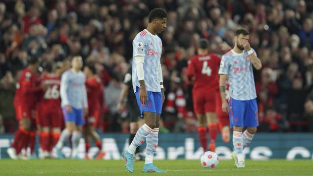 Manchester United Manchester United's Marcus Rashford, left, and Manchester United's Bruno Fernandes, right, gesture as Liverpool's Mohamed Salah celebrates with his teammates after scoring his side's second goal during the English Premier League soccer match between Liverpool and Manchester United at Anfield stadium in Liverpool, England, Tuesday, April 19, 2022. (AP Photo/Jon Super)