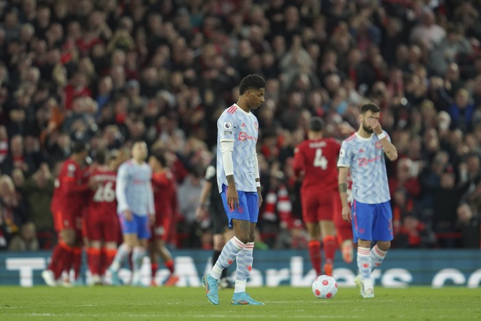 Marcus Rashford Manchester United's Marcus Rashford, left, and Manchester United's Bruno Fernandes, right, gesture as Liverpool's Mohamed Salah celebrates with his teammates after scoring his side's second goal during the English Premier League soccer match between Liverpool and Manchester United at Anfield stadium in Liverpool, England, Tuesday, April 19, 2022. (AP Photo/Jon Super)