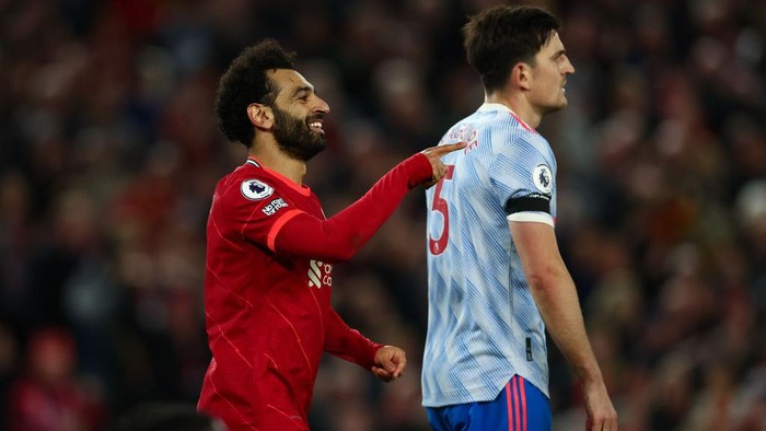 LIVERPOOL, ENGLAND - APRIL 19: Mohamed Salah of Liverpool celebrates scoring their sides fourth goal during the Premier League match between Liverpool and Manchester United at Anfield on April 19, 2022 in Liverpool, England. (Photo by Clive Brunskill/Getty Images)