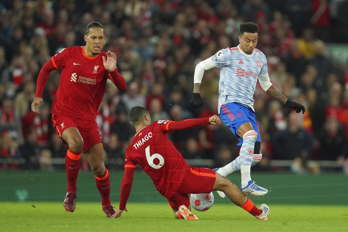 Thiago Alcantara Manchester United's Jesse Lindgard, right, is challenged by Liverpool's Thiago, center, and Liverpool's Virgil van Dijk during the English Premier League soccer match between Liverpool and Manchester United at Anfield stadium in Liverpool, England, Tuesday, April 19, 2022. (AP Photo/Jon Super)