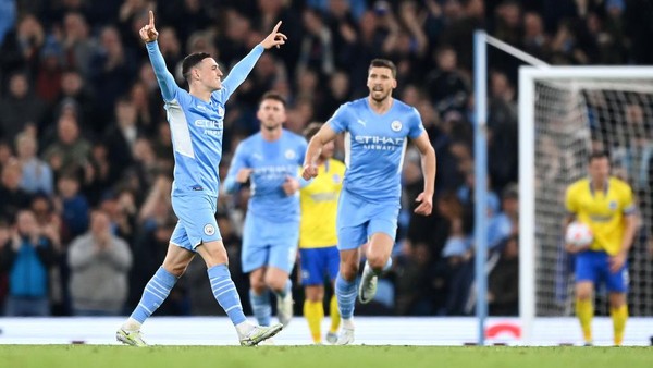 1392608013 MANCHESTER, ENGLAND - APRIL 20: Phil Foden of Manchester City celebrates after scoring their teams second goal during the Premier League match between Manchester City and Brighton & Hove Albion at Etihad Stadium on April 20, 2022 in Manchester, England. (Photo by Shaun Botterill/Getty Images)