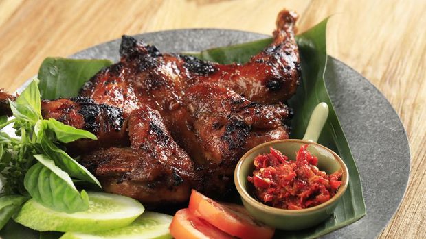 Ayam bekakak Bakakak Hayam or Ayam Bekakak or Grilled Whole Chicken Seasoning with Soy Sauce. Dish from West Java and Jakarta, Indonesia. Close Up