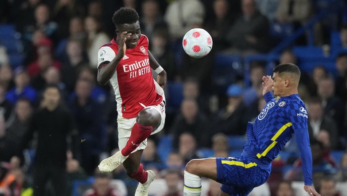 Arsenals Eddie Nketiah, left vies for the ball with Chelseas Thiago Silva during the English Premier League soccer match between Chelsea and Arsenal at Stamford Bridge in London, Wednesday, April 20, 2022. (AP Photo/Frank Augstein)