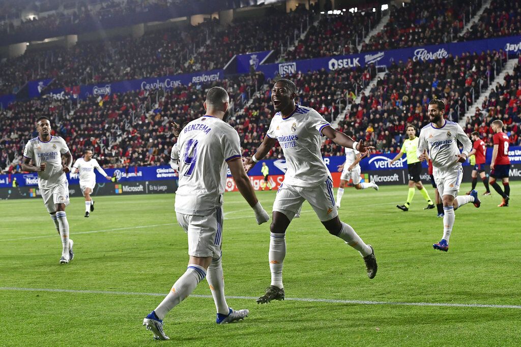 Real Madrid Real Madrid's David Alaba, centre right, celebrates with Karim Benzema after scoring the opening goal during a Spanish La Liga soccer match between Osasuna and Real Madrid at El Sadar stadium in Pamplona, Spain, Wednesday, April 20, 2022. (AP Photo/Alvaro Barrientos)
