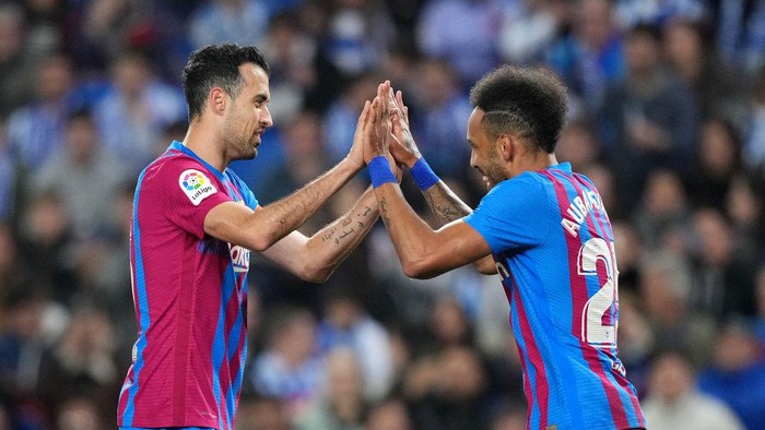 SAN SEBASTIAN, SPAIN - APRIL 21: Pierre-Emerick Aubameyang of FC Barcelona celebrates after scoring their sides first goal with Sergio Busquets during the LaLiga Santander match between Real Sociedad and FC Barcelona at Reale Arena on April 21, 2022 in San Sebastian, Spain. (Photo by Juan Manuel Serrano Arce/Getty Images)