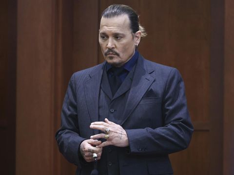 Actor Johnny Depp stands in the courtroom at the Fairfax County Circuit Court in Fairfax, Va., Thursday, April 21, 2022. Actor Johnny Depp sued his ex-wife Amber Heard for libel in Fairfax County Circuit Court after she wrote an op-ed piece in The Washington Post in 2018 referring to herself as a 