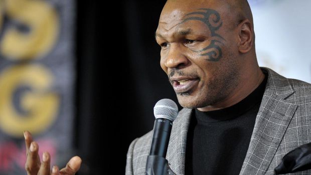 FILE - Former boxer Mike Tyson holds a news conference on Feb. 21, 2014, in Bethlehem, Pa. Authorities are investigating after cellphone video appears to show Mike Tyson hitting another passenger on a plane at San Francisco International Airport. (Stephen Flood/The Express-Times via AP, File)