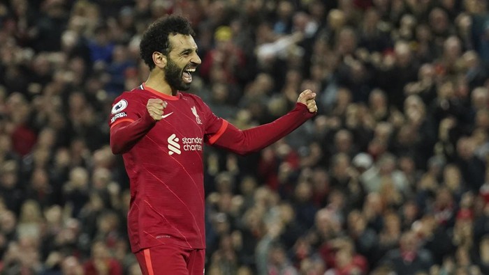 Liverpools Mohamed Salah celebrates after scoring his sides fourth goal during the English Premier League soccer match between Liverpool and Manchester United at Anfield stadium in Liverpool, England, Tuesday, April 19, 2022. (AP Photo/Jon Super)